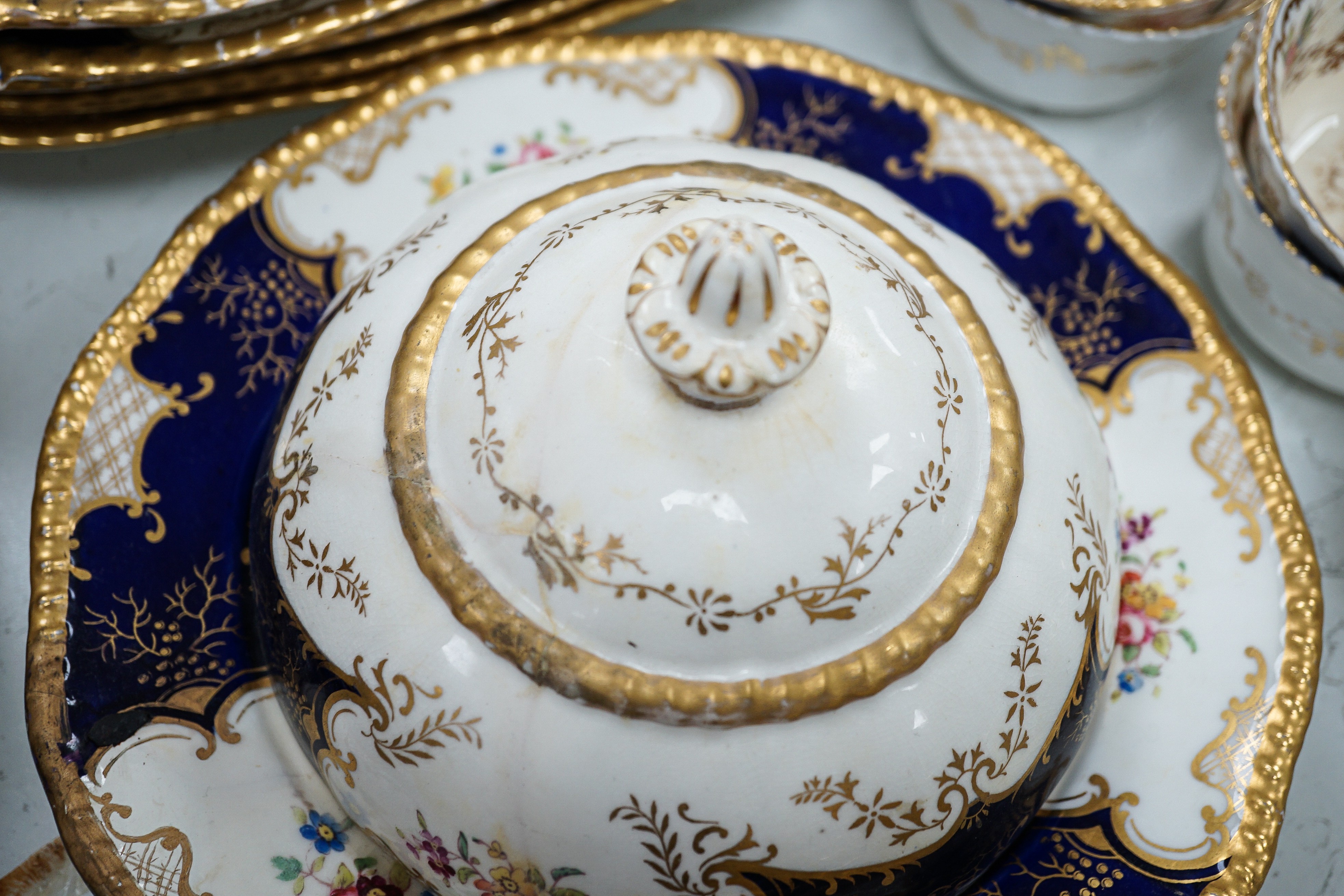 A large set of Coalport blue ground tea and coffee service and similar green ground tea wares